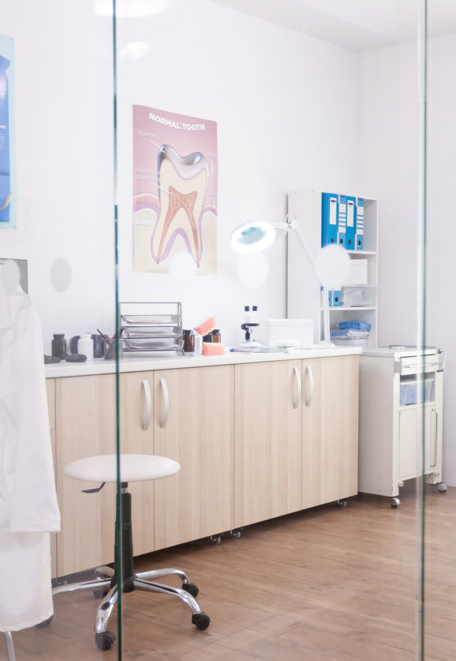 Empty stomatology orthodontist hospital cabinet with nobody in it equipped with professional medical furniture. Teeth radiography images on monitor revealing tooth dental diagnosis